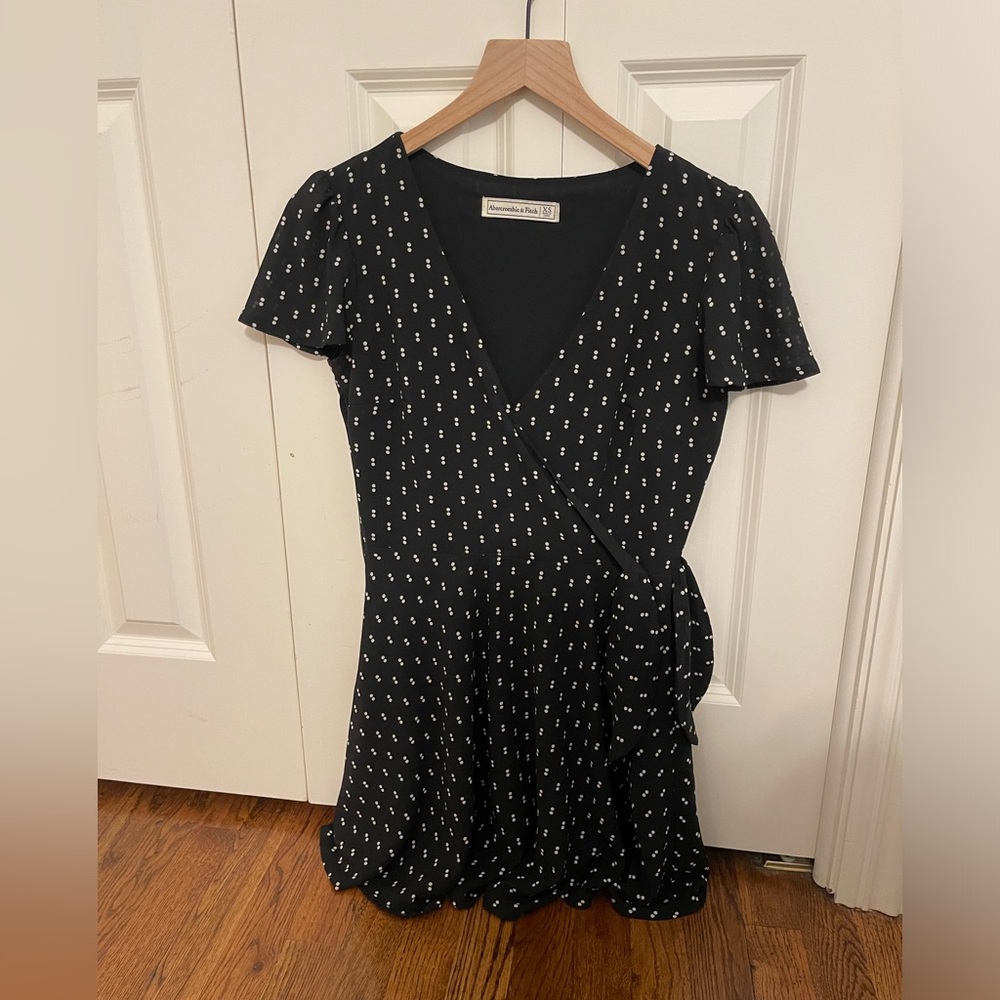 Spring polka dot mini dress. Is kinda a wrap v-neck with a bow tie on the side